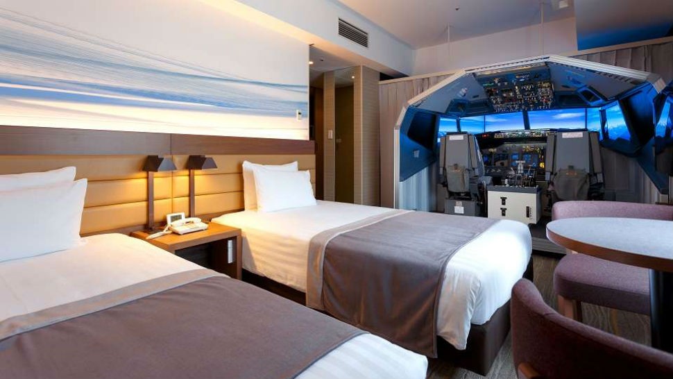 This hotel room has a Boeing 737 Flight Simulator in it