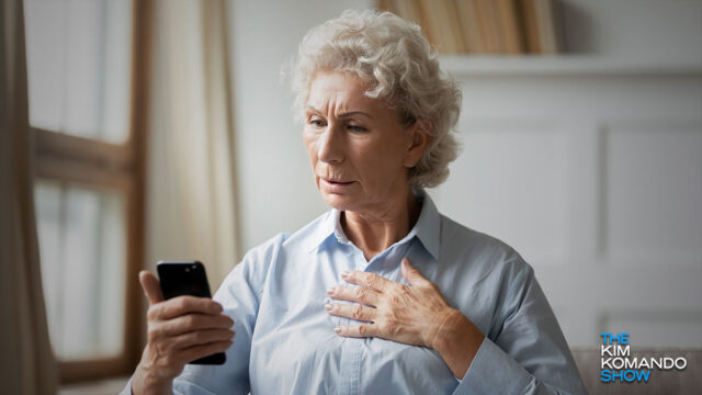 elderly woman holding a phone