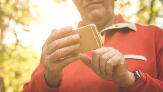 older man on a smartphone