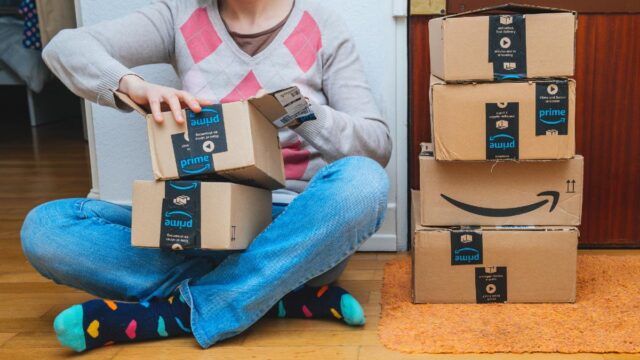 woman opening amazon boxes