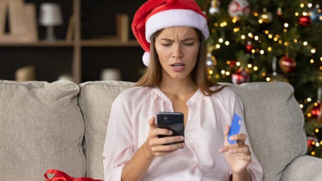 concerned woman on phone during christmas