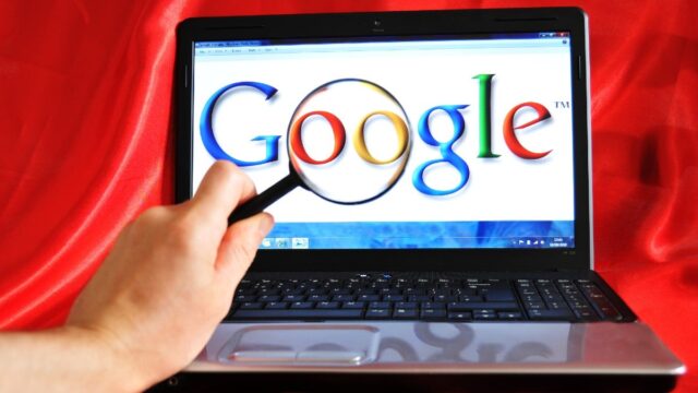 google logo on laptop with magnifying glass