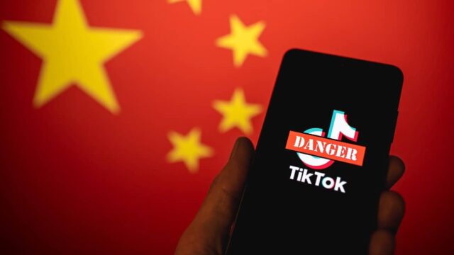 tiktok app with danger sign and china flag in background