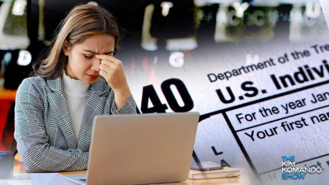 woman on laptop dealing with taxes